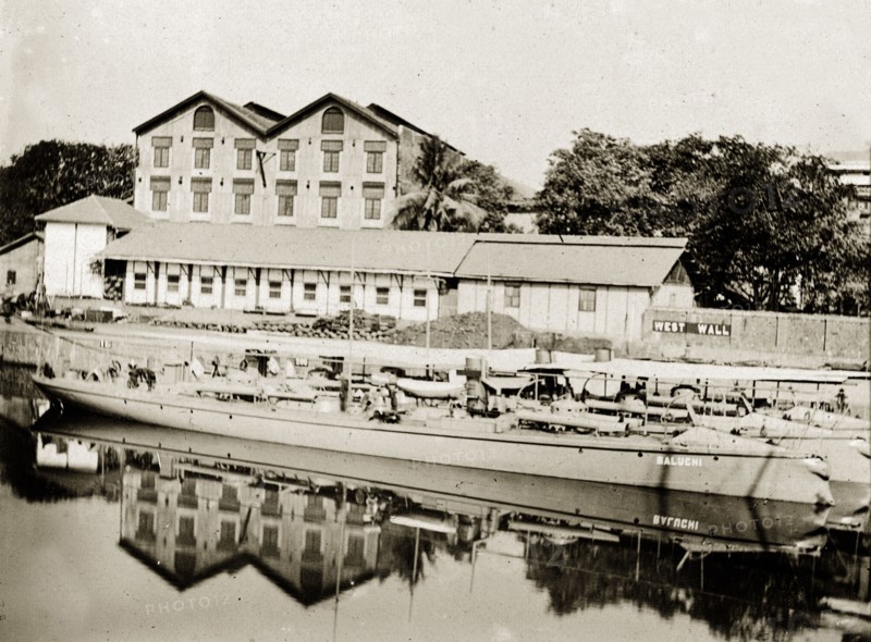 A Bombay dockyard. Long barges moored in a dockyard. Bombay (Mumbai), India, circa 1900. Mumbai, Maharashtra, India, Southern Asia, Asia.