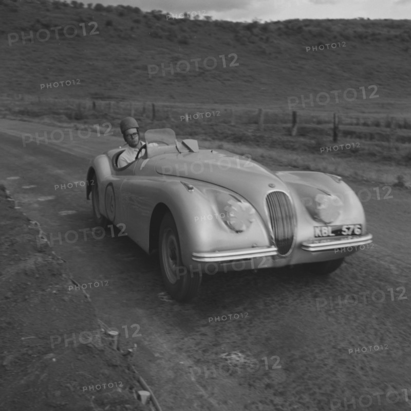 Mandeville competes at Langa Langa. Mandeville drives a powerful sports car in the last race of an event held at the Langa Langa racing circuit. Langa Langa, Kenya, 13 October 1952. Langa Langa, Rift Valley, Kenya, Eastern Africa, Africa.