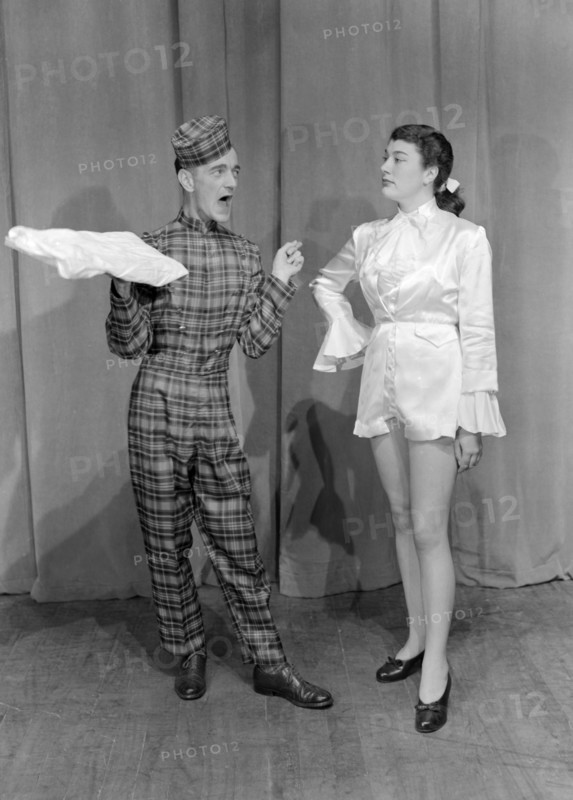 Cast of Cinderella. Two performers in character as Dandini and Buttons from Cinderella. Kenya, 12 December 1952. Kenya, Eastern Africa, Africa.