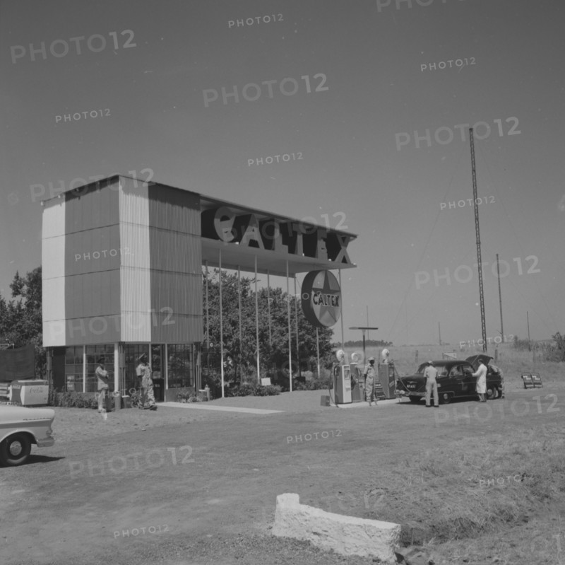 Caltex service station. A car is attended on the forecourt of an ultra-modern Caltex service station. Kenya 25 September 1957. Kenya, Eastern Africa, Africa.
