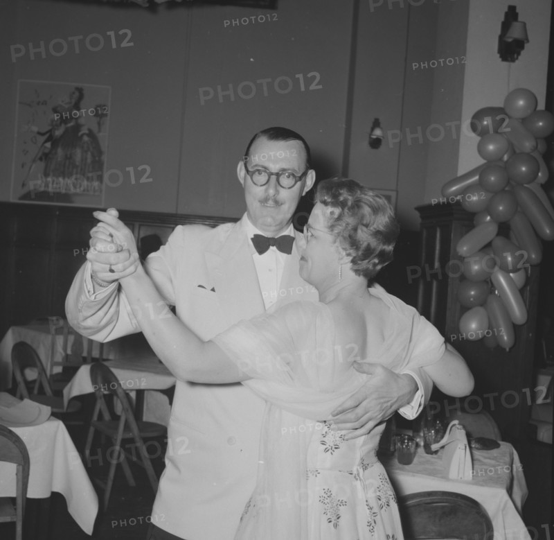 Northern Counties dance. A formally dressed couple, captured on the dance floor at the Northern Counties dance. Kenya, 2 November 1957. Kenya, Eastern Africa, Africa.