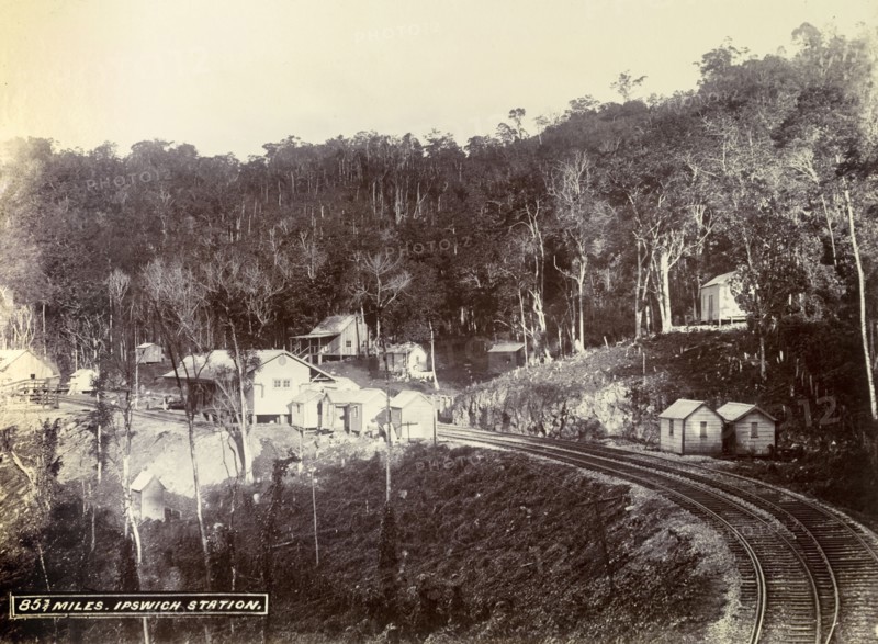 Ipswich railway station. Wooden buildings constructed on cleared forest land surround the track at Ipswich railway station. Ipswich, Jamaica, circa 1895. Ipswich, St Elizabeth, Jamaica, Caribbean, North America .