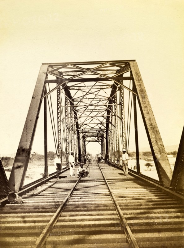 Construction workers on a bridge. Construction workers pictured on a newly completed railway bridge. Opening in 1896, this stretch of track was part of the Port Antonio extension line. Portland, Jamaica, circa 1895., Portland, Jamaica, Caribbean, North America .