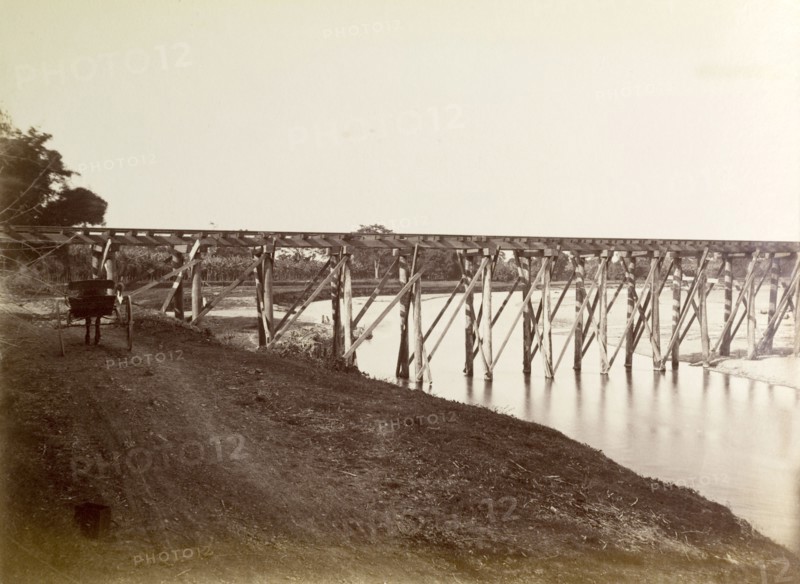 Port Antonio extension line. A narrow trestle bridge carries the Port Antonio railway extension line across a river. Portland, Jamaica, circa 1895., Portland, Jamaica, Caribbean, North America .
