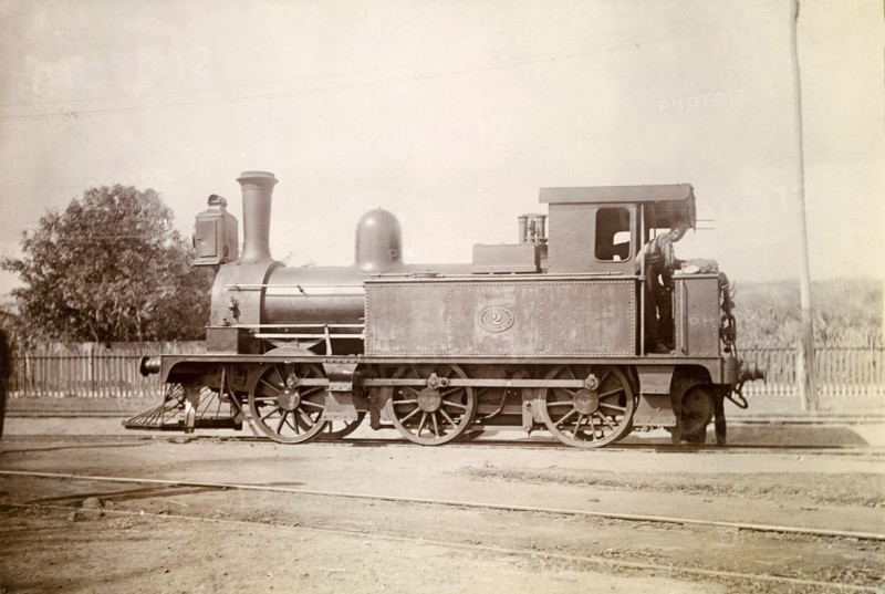 British steam locomotive, Jamaica. A British-manufactured steam locomotive sits on rails at a siding. A plaque on its side reads: 'Jamaica Railway 2', followed by a date which appears to read '1879'. Jamaica, circa 1895. Jamaica, Caribbean, North America .