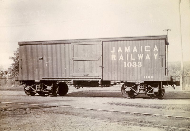Box carriage, Jamaica. A box carriage inscribed 'Jamaica Railway 1033' sits on rails at a siding. Jamaica, circa 1895. Jamaica, Caribbean, North America .