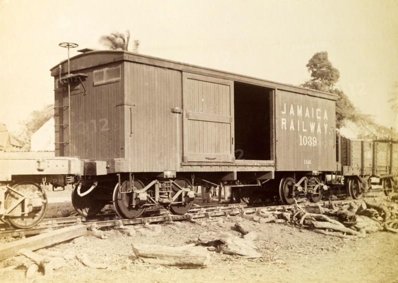 Jamaica Railway box wagon. An box railway wagon inscribed 'Jamaica Railway 1039', sits on rails at a siding. Jamaica, circa 1895. Jamaica, Caribbean, North America .