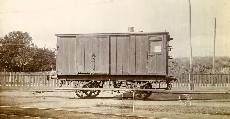 Jamaica Railway wagon. A closed railway wagon sits on rails at a siding. Jamaica, circa 1895. Jamaica, Caribbean, North America .