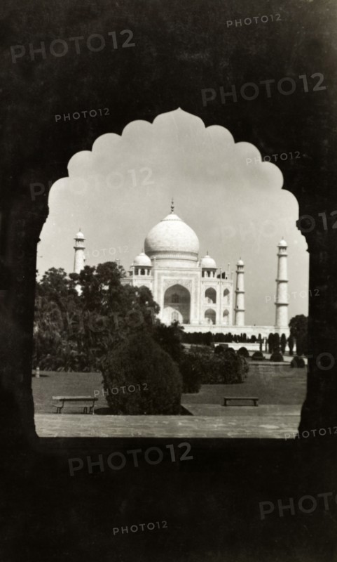 The Taj Mahal, circa 1925. View of the Taj Mahal, framed by an ornately-shaped doorway. Agra, United Provinces (Uttar Pradesh), India, circa 1925. Agra, Uttar Pradesh, India, Southern Asia, Asia.