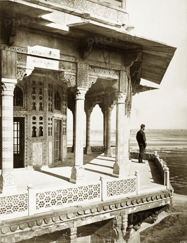 View from the Samman Burj. A lone figure takes in the view from a balcony on the Samman Burj, an octagonal tower located within the Agra Fort complex. Agra, North Western Provinces (Uttar Pradesh), India, circa 1885. Agra, Uttar Pradesh, India, Southern Asia, Asia.