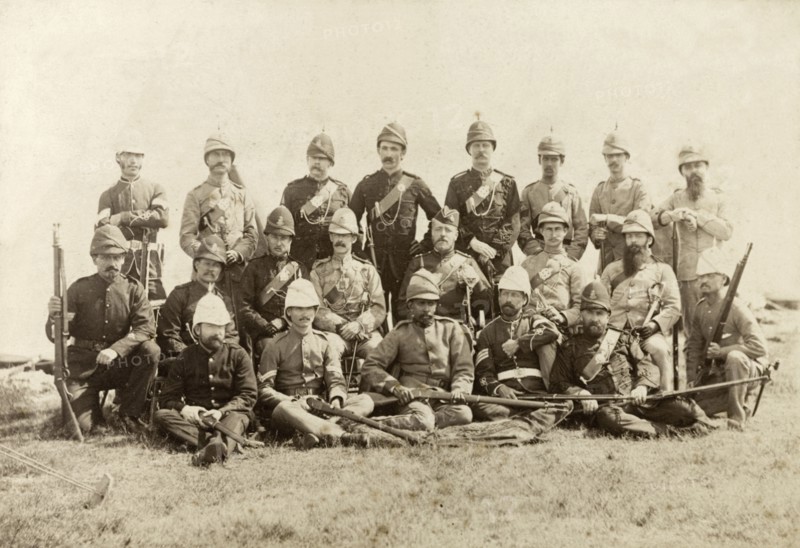 Wimbledon rifle team. 21 European and Indian members of a rifle team pose for a group portrait with their weapons, dressed in a variety of military uniforms. Wimbledon, England, circa 1889. Wimbledon, London, Greater, England (United Kingdom), Western Europe, Europe .