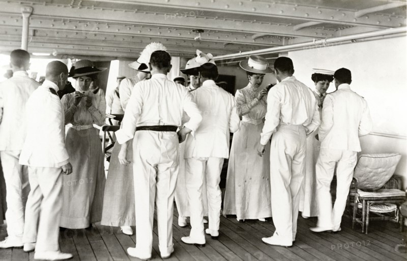 Royal thread-needle race. Queen Mary and her Ladies in Waiting participate in a thread-needle race aboard HMS Medina. The royal yacht was transporting King George V and Queen Mary to India for the Coronation Durbar at Delhi. Indian Ocean near Mumbai, India, circa 30 November 1911. India, Southern Asia, Asia.