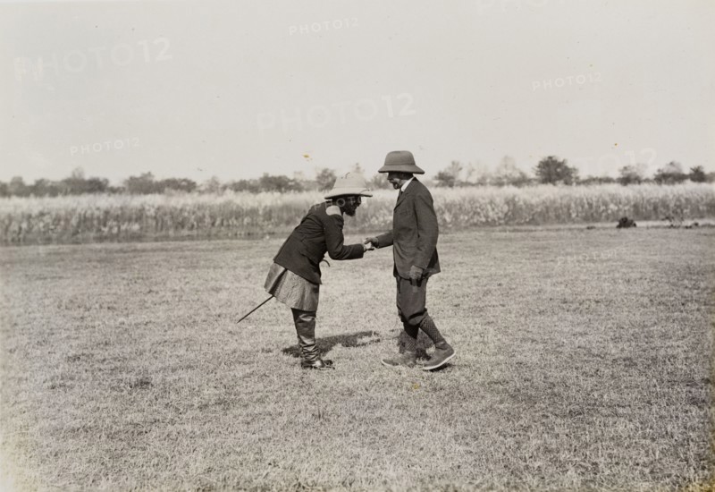 Maharajah meets King. Maharajah Chandra Shamsher Jang of Nepal bows as he shakes the hand of King George V (r.1910-36). The Maharajah hosted the King on his hunting trip to Chitwan Valley, Nepal following the Coronation Durbar at Delhi. Nepal, circa 18 December 1911. Nepal, Southern Asia, Asia.