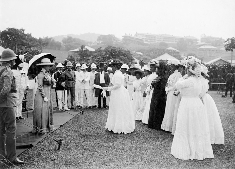 African women at a royal reception. The Duchess of Connaught addresses a group of local African women dressed in Western-style clothing at an outdoor reception by Bechuanaland chiefs. This was one of several stops made by the Duke following his official visit to Cape Town to open the new Union Parliament. Gaberones, Bechuanaland (Gaborone, Botswana), 24 November 1910. Gaborone, South East (Botswana), Botswana, Southern Africa, Africa.