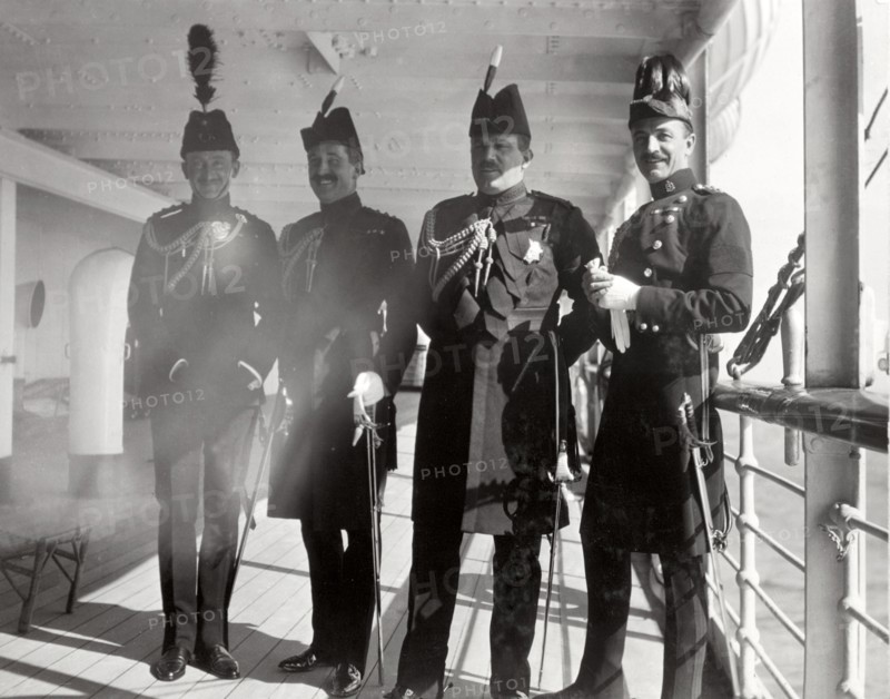 British officers aboard the S.S. Balmoral Castle. Four high-ranking British officers in full military regalia pose for the camera aboard the S.S. Balmoral Castle. Durban, Natal (KwaZulu Natal), South Africa, circa 2 December 1910. Durban, KwaZulu Natal, South Africa, Southern Africa, Africa.