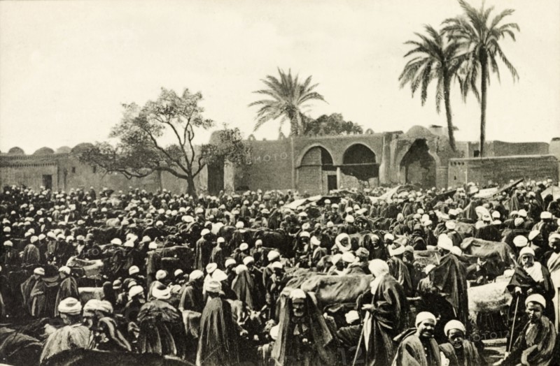 Market at Giza. A throng of people crowd an open air market at Giza. Giza, Egypt, circa 1900. Giza, Giza, Egypt, Northern Africa, Africa.