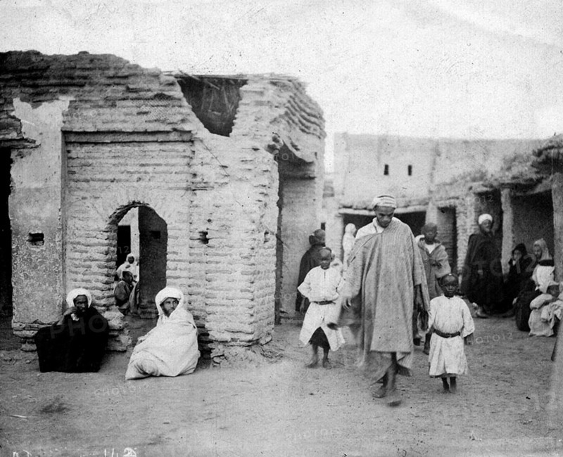 Moroccan slave market. Men and children at a Moroccan slave market. Morocco, circa 1911. Morocco, Northern Africa, Africa.