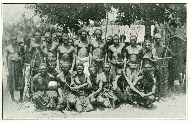 Congolese rubber slaves. Portrait of a group of male slaves, tied together with ropes around their necks and arranged in rows for the camera. The men are rubber workers, enslaved under King Leopold II's terror regime. Kasai, Congo Free State (Democratic Republic of Congo), circa 1904., Kasai, Congo, Democratic Republic of, Central Africa, Africa.