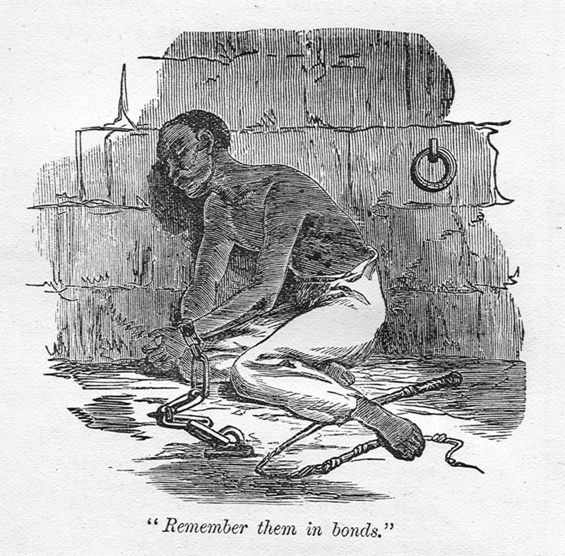 Remember them in bonds'. A slave with bound hands is chained to the floor of a cell, kneeling beside a discarded whip that is perhaps an indicator of recent punishment. An original caption quotes a line from the Bible: 'Remember them in bonds'. Probably Caribbean, circa 1820., Caribbean, North America .