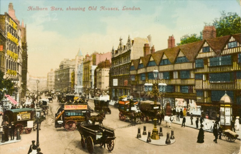 Road junction in Holborn. A busy road junction in Holborn. Pedestrians and horse-drawn carts and coaches crowd the street outside a terrace of half-timbered houses dating from the Tudor period. London, England, circa 1890. London, London, City of, England (United Kingdom), Western Europe, Europe .