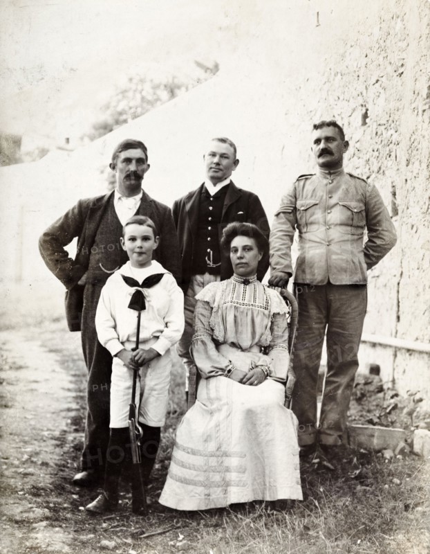 Group portrait in Gibraltar. Group portrait featuring three men, a women and a child. This is one of several photographs taken during a royal visit to Gibraltar by King Edward VII (1841-1910) and Kaiser Wilhelm II (1859-1941). The group featured are probably part of the royal entourage and may even be royal family members. Gibraltar, 1904., Gibraltar, Gibraltar, Mediterranean, Europe .