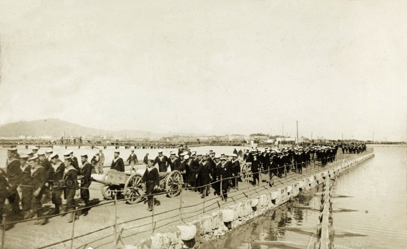 Naval troops at Gibraltar. British naval troops march along a quayside. One of several photographs taken during a royal visit to Gibraltar by King Edward VII (1841-1910) and Kaiser Wilhelm II (1859-1941), the men were probably on their way to or from an official parade held in honour of the visiting monarchs. Gibraltar, 1904., Gibraltar, Gibraltar, Mediterranean, Europe .