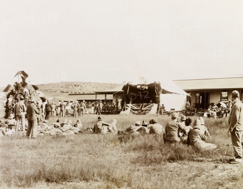 Christmas Day performance at Harrismith. British soldiers and their wives celebrate Christmas Day with a performance held at the 19th Stationary Hospital camp, a convalescent camp established in a valley below the Platberg Mountain during the Second Boer War (1899-1902). Harrismith, Orange River Colony (Free State), South Africa, 25 December 1901. Harrismith, Free State, South Africa, Southern Africa, Africa.