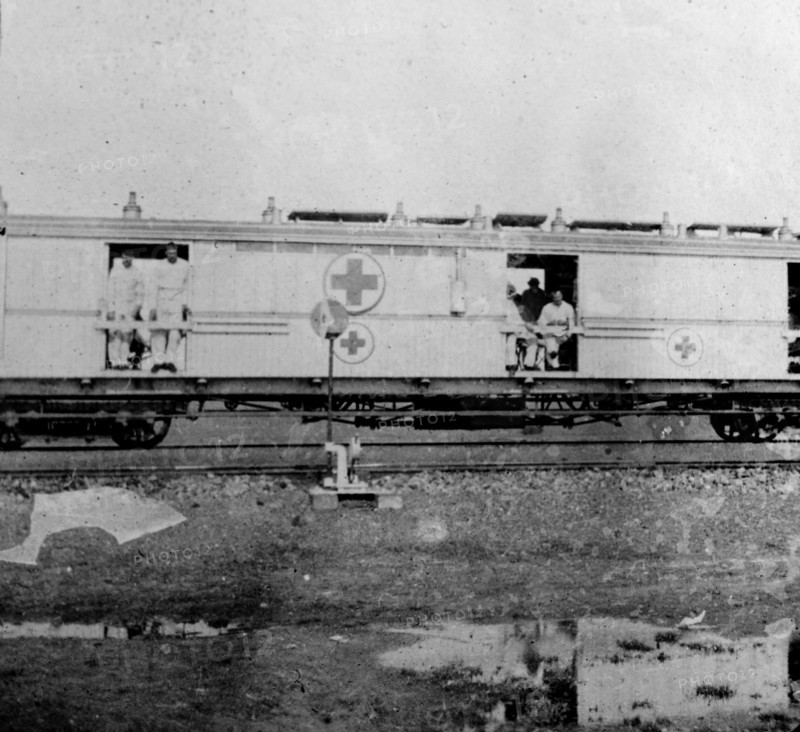 Boer War hospital train. Soldiers injured during the Second Boer War (1899-1902), sit inside the open carriage doorways of a hospital train as they are transported away from the battlefields. South Africa, circa 1900. South Africa, Southern Africa, Africa.