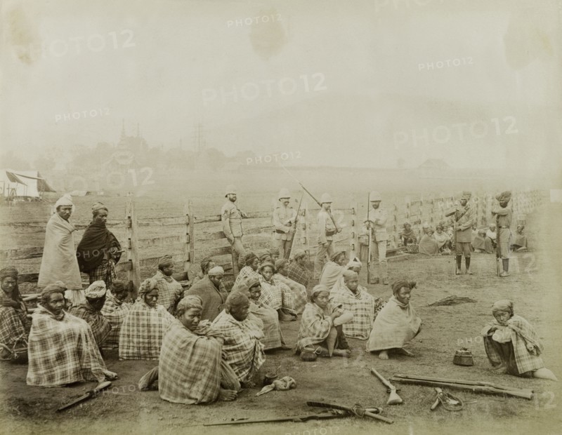 Burmese rebels surrender at Wuntho. Captured Burmese rebels surrender their arms to British forces under a general amnesty. Allied to the Saopha of Wuntho, their opposition to the British annexation of Burma (Mynamar) led to conflict at Wuntho where they subsequently lost control of the area. Wuntho, Burma (Myanmar), 1891. Wuntho, Sagaing, Burma (Myanmar), South East Asia, Asia.
