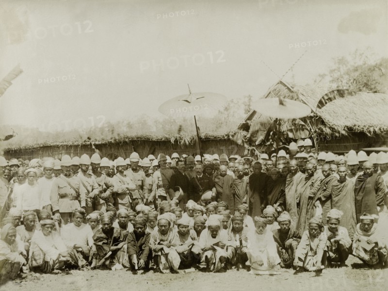 An audience at Wuntho Palace. General Wolseley (centre) presides over an official gathering at Wuntho Palace, shortly after its capture by British troops. British Army officers surround him to the left: a line of Buddhist monks stands to the right. Several traditionally dressed Burmese men crouch on the ground in the front row. Wuntho, Burma (Myanmar), 1891. Wuntho, Sagaing, Burma (Myanmar), South East Asia, Asia.