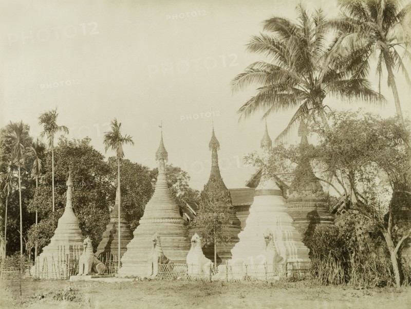Stone 'zeidis' at Wuntho. Several carved stone 'zeidis' or pagodas are guarded by stone 'chinthes' (mythical Burmese lions) at Wuntho. This scene was captured shortly after British forces took control of Wuntho following a conflict with Burmese rebels. Wuntho, Burma (Myanmar), 1891. Wuntho, Sagaing, Burma (Myanmar), South East Asia, Asia.
