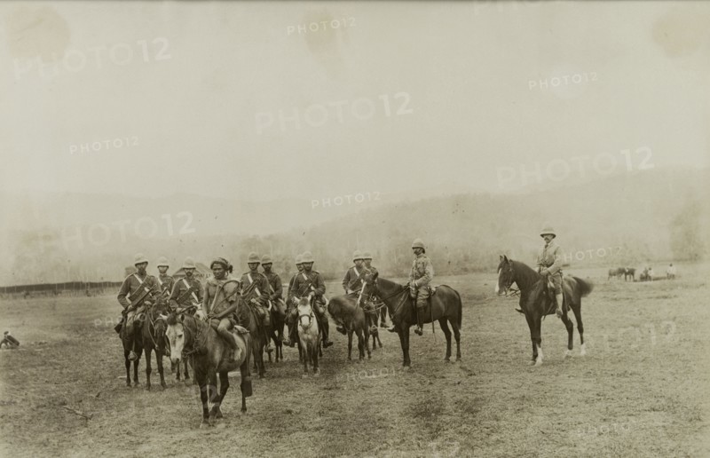 Wolseley and Smyth follow a scout. A local Burmese scout leads General Wolseley, Major Smyth and other military officers into the countryside on horseback. Both officers led British Army troops against Burmese rebels during a conflict at Wuntho. Sagaing, Burma (Myanmar), 1891., Sagaing, Burma (Myanmar), South East Asia, Asia.