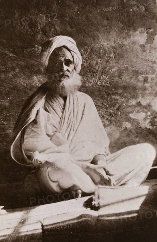 Portrait of Osman Digna. Portrait of Osman Digna (c.1836-1900), sitting cross-legged on a mat, wearing a robe and turban. Digna was a general in the Mahdist army of Sudan from 1883 until his arrest by the British in 1900. Sudan, circa 1887. Sudan, Eastern Africa, Africa.