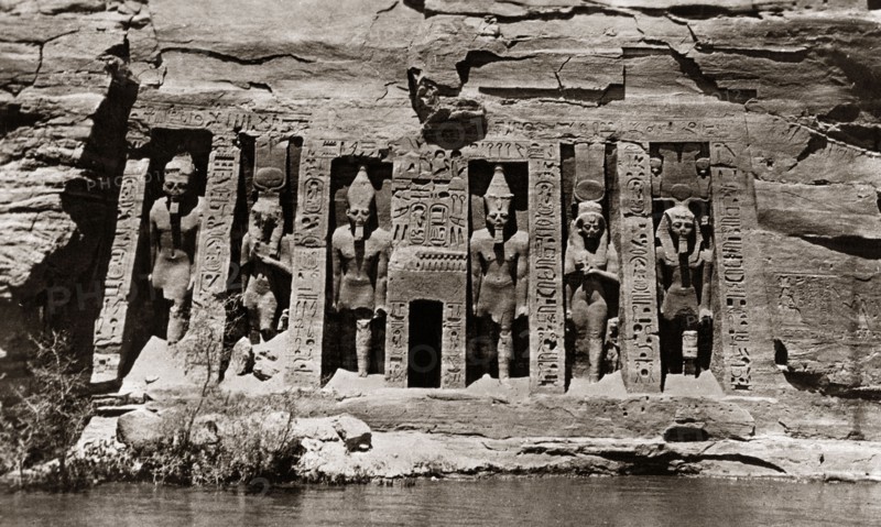 Carvings at the Abu Simbel rock temples. Ancient Egyptian hieroglyphs and figures are carved into a rockface at the twin temples of Abu Simbel. Near Aswan, Egypt, circa 1910., Aswan, Egypt, Northern Africa, Africa.