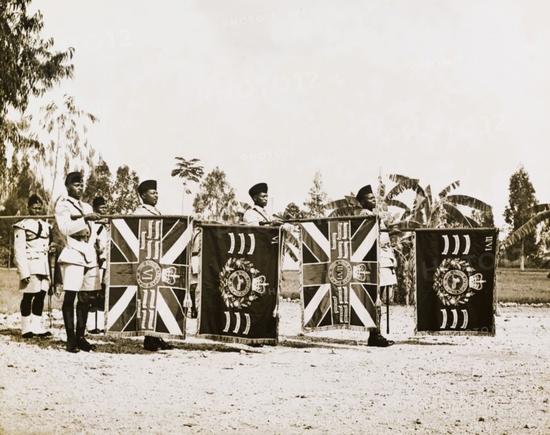 The Tanganyika Rifles present their colours. Soldiers of the Tanganyika Rifles present their colours during a visit by Sir Richard Turnbull (1909-1998), the last British colonial Governor of Tanganyika. Tanganyika (Tanzania), 1962. Tanzania, Eastern Africa, Africa.