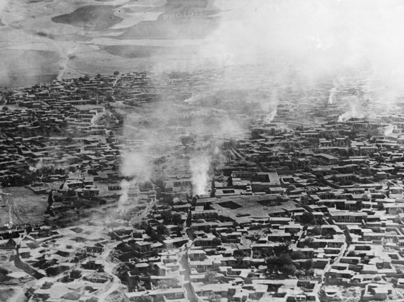 Smoke rises from Sulaymaniyah. Smoke rises from several points across the Kurdistan city of Sulaymaniyah. An original caption suggests the town had recently been bombed by the British Royal Air Force: possibly a reference to the RAF bombing of Sheikh Mahmud's house in December 1923, when he proclaimed himself King of Kurdistan in defiance of British control. Sulaymaniyah, British Mandate of Mesopotamia (Iraq), circa December 1923. Sulaymaniyah, Sulaymaniyah, Iraq, Middle East, Asia.