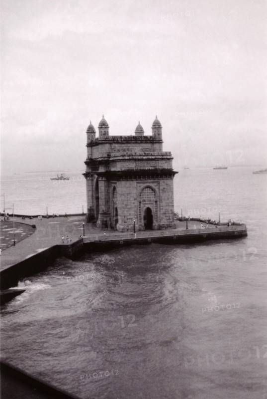 The Gateway of India, Bombay. View of the Gateway of India, situated on the waterfront of Bombay Harbour. Built to commemorate the visit of King George V and Queen Mary in 1911, the Gateway is traditionally the first landmark to be seen by visitors arriving by boat. Bombay (Mumbai), India, circa 1945. Mumbai, Maharashtra, India, Southern Asia, Asia.
