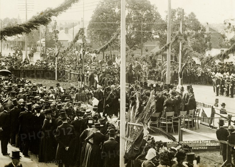 Laying the foundation stone for a new museum. A crowd gathers to watch the Duke of Cornwall and York (later King George V) lay the foundation stone of a new musuem. The Duchess was also present during the visit, which was made shortly after the royal couple had opened the first Commonwealth Parliament of Australia in Melbourne. Perth, Australia, 24 July 1901. Perth, West Australia, Australia, Australia, Oceania.