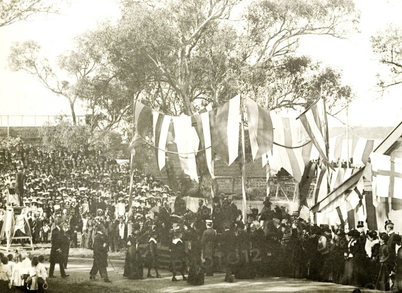 The Duke and Duchess address school children, Perth. Crowds of spectators watch as the Duke and Duchess of Cornwall and York (later King George V and Queen Mary) address school children in the grounds of Government House. Perth, Australia, 25 July 1901. Perth, West Australia, Australia, Australia, Oceania.
