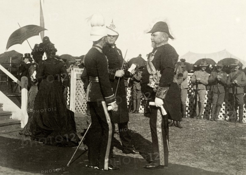 Sir John Forrest awaits the Bishop of Perth. Sir John Forrest (right), the Australian Federal Minister of Defence, talks with two military officers as they await the arrival of the Bishop of Perth at an official ceremony. Perth, Australia, circa 1902. Perth, West Australia, Australia, Australia, Oceania.