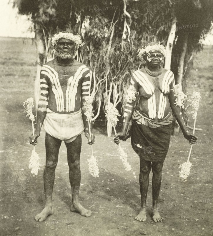 Aborigines in ceremonial costume. Portrait of two middle-aged aborigines, dressed in ceremonial costume to meet Sir Arthur Lawley and his family. Naked from the waist up, their bodies are painted with stripes and they wear crowns of twigs on their heads. Western Australia, Australia, circa 1901., West Australia, Australia, Australia, Oceania.
