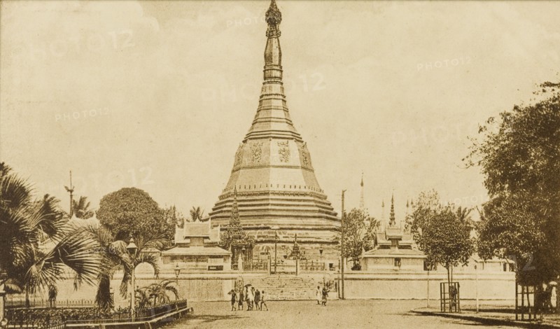 The Sule Pagoda in Rangoon. A line of trees flanks a promenade leading up to the Sule Pagoda. Rangoon (Yangon), Burma (Myanmar), circa 1920. Yangon, Yangon, Burma (Myanmar), South East Asia, Asia.