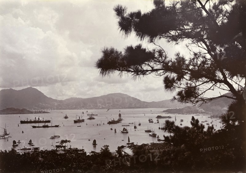 Hong Kong's Victoria Harbour, 1903. View of Victoria Harbour taken from Hong Kong Island overlooking the Kolwoon peninsula. A variety of vessels are visible, ranging from British naval ships to Chinese sampans. Hong Kong, China, 1903. Hong Kong, Hong Kong, China, People's Republic of, Eastern Asia, Asia.