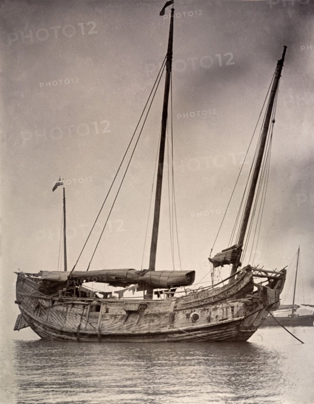 A Chinese junk at anchor. A Chinese junk, pictured at anchor with its sails rolled down. Hong Kong, China, circa 1903., Hong Kong, China, People's Republic of, Eastern Asia, Asia.