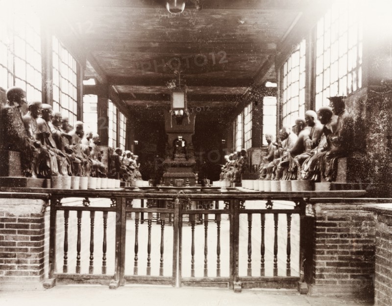 The Temple of 500 Genii, Canton. Interior view of the Buddhist Temple of 500 Genii. The statues of genii that line the walls represent the 500 disciples of Buddha who supposedly founded the temple in around 500AD. Canton, Canton Province (Guangzhou, Guangdong), China, circa 1905. Guangzhou, Guangdong, China, People's Republic of, Eastern Asia, Asia.