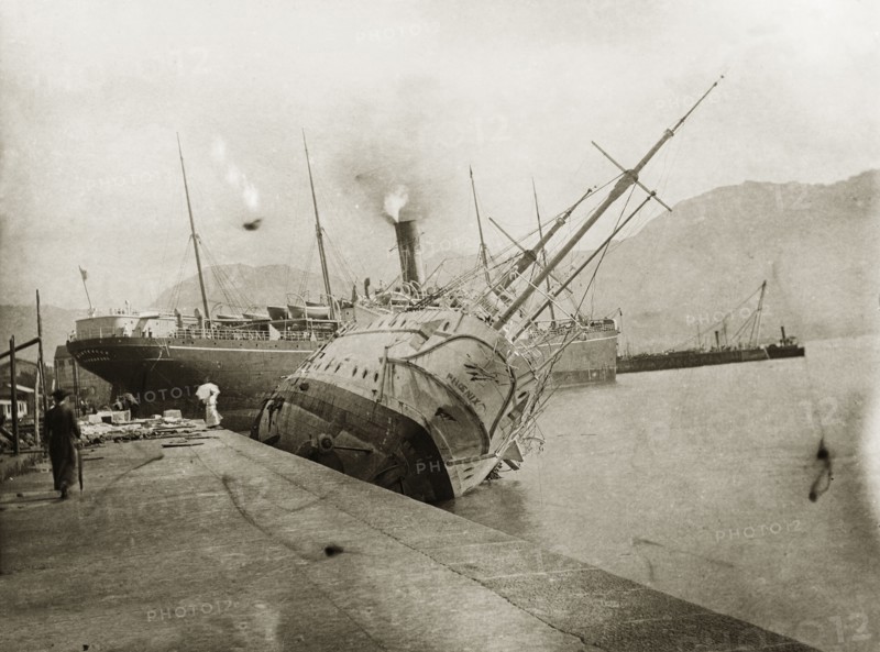 British naval ships stricken by a typhoon. Two British naval steamships, HMS Phoenix and RMS Monteagle, lie stricken in shallow waters in the aftermath a devastating typhoon that killed an estimated 10,000 people. Kowloon, Hong Kong, China, circa 19 September 1906. Kowloon, Hong Kong, China, People's Republic of, Eastern Asia, Asia.