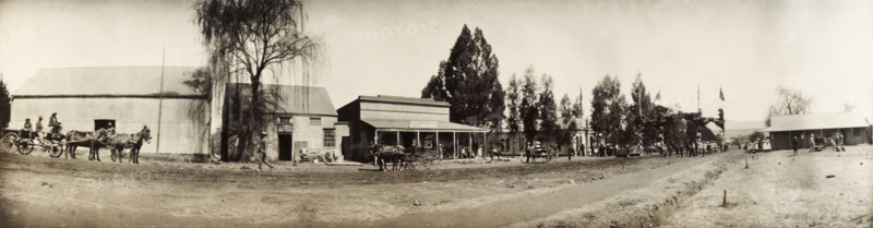 Decorated street in Lydenburg. Panoramic view of a street in Lydenburg, decorated with flags and a welcome arch in honour of Sir Arthur Lawley (1860-1932), Lieutenant Governor of the Transvaal. Sir Lawley was visiting to present the New Year and Birthday Honours on behalf on King Edward VII. Lydenburg, South Africa, 1903. Lydenburg, Mpumalanga, South Africa, Southern Africa, Africa.