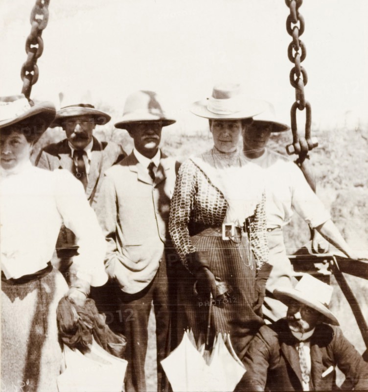 Preparing to cross the Zambezi gorge. A group of British passengers, including Lady Annie Lawley (wife of Sir Arthur Lawley) and Arthur Rhodes (brother of Cecil John Rhodes), prepare to cross the Zambezi gorge at Victoria Falls in a cage attached to a cable system. Matabeleland, Rhodesia (Matabeleland North, Zimbabwe), circa 1904., Matabeleland North, Zimbabwe, Southern Africa, Africa.