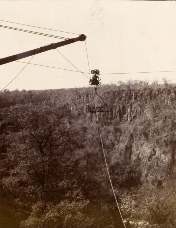 Cable system across the Zambezi gorge. A cage attached to a cable system is suspended high above the Zambezi gorge, designed to carry passengers over the river at Victoria Falls. Matabeleland, Rhodesia (Matabeleland North, Zimbabwe), circa 1904., Matabeleland North, Zimbabwe, Southern Africa, Africa.