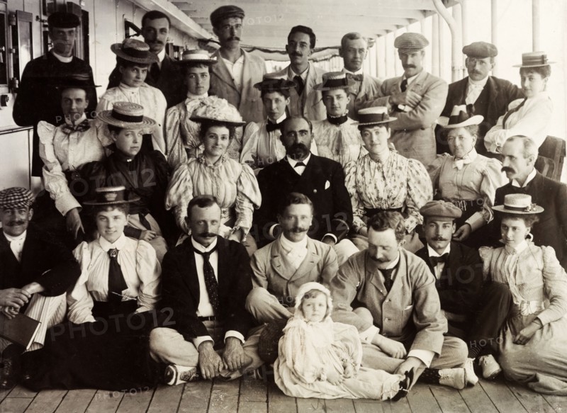 First Class passengers on SS Norman. First Class passengers of the SS Norman pose for a group portrait with Captain Maloney (centre), enroute from England to Cape Town. Atlantic Ocean, March 1897., Atlantic Ocean, Africa.